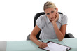 Bored woman taking notes