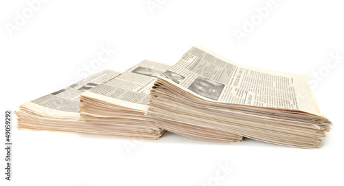 Photo: newspapers isolated on white background newspapers isolated on white background