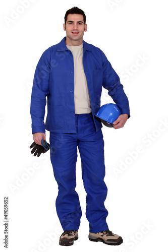 Photo: craftsman holding his gloves and a helmet craftsman holding his gloves and a helmet