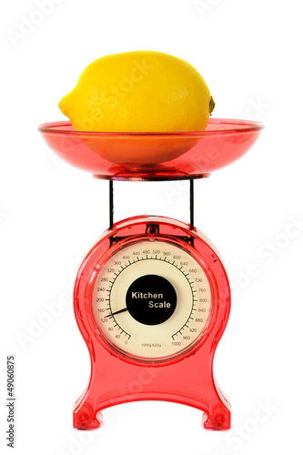 Photo: Red kitchen scales and lemon Red kitchen scales and lemon