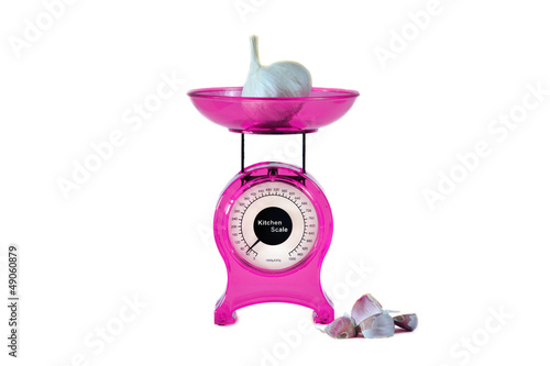 Photo: Magenta kitchen scales and garlic Magenta kitchen scales and garlic