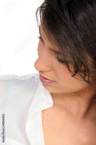 Photo: Woman glancing down Woman glancing down