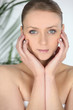 Woman at a spa with her chin in her hands
