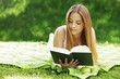 Foto: Young woman reading book Young woman reading book