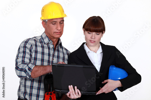 Photo: Architect and builder with a laptop Architect and builder with a laptop