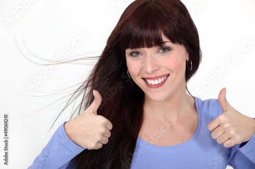 Photo: Woman giving the thumbs up Woman giving the thumbs up