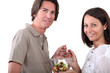 Couple eating fruit salad