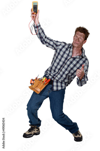 Photo: Electrician checking the voltage and getting a shock Electrician checking the voltage and getting a shock