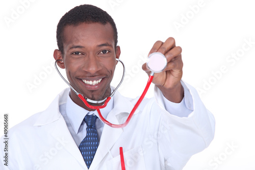 Photo: Physician holding up a stethoscope Physician holding up a stethoscope