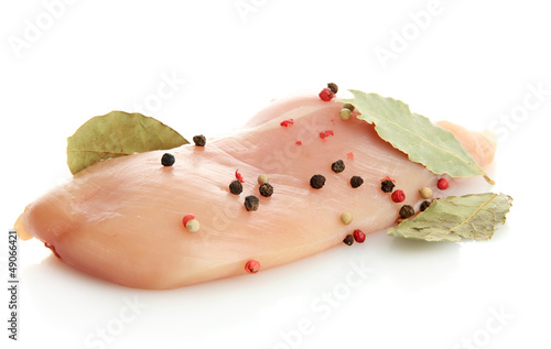 Photo: raw chicken meat with spices, isolated on white raw chicken meat with spices, isolated on white