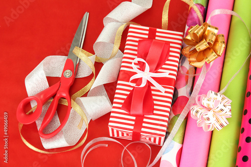 Photo: Rolls of Christmas wrapping paper with ribbons, bows Rolls of Christmas wrapping paper with ribbons, bows