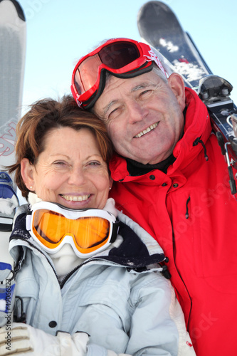 Photo: Smiling man and woman in ski resort Smiling man and woman in ski resort