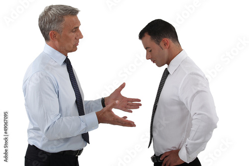 Photo: Boss and employee having a serious discussion Boss and employee having a serious discussion