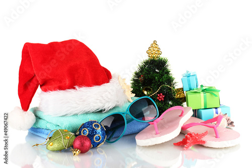 Photo: Beach accessories and Christmas tree isolated on white Beach accessories and Christmas tree isolated on white