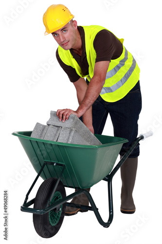 Photo: Laborer with a wheelbarrow Laborer with a wheelbarrow