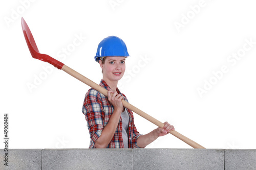 Photo: Female mason holding shovel Female mason holding shovel
