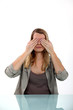 Woman covering her eyes