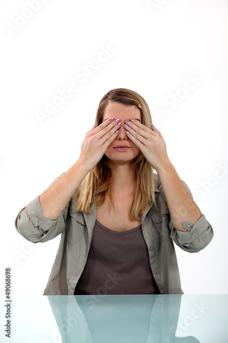 Photo: Woman covering her eyes Woman covering her eyes