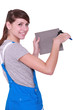 Photo: Woman cutting tile Woman cutting tile