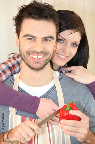 Photo: Couple cooking together Couple cooking together