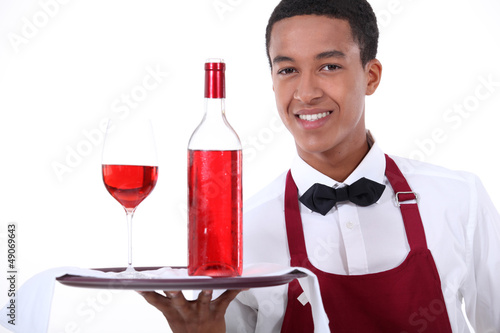 Photo: Male waiter with wine on tray Male waiter with wine on tray