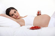 Photo: Pregnant woman with a bowl of tomatoes Pregnant woman with a bowl of tomatoes
