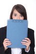 Surprised woman with an office clipboard