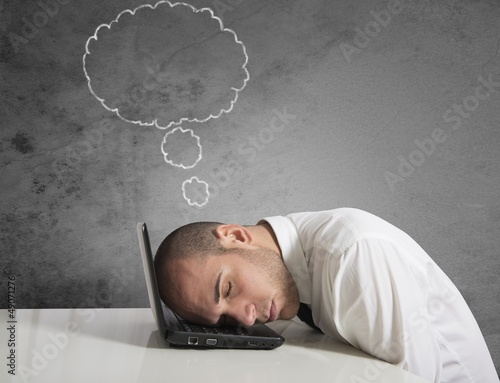 Photo: Businessman dreams while sleeping Businessman dreams while sleeping