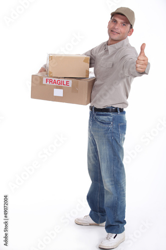 Photo: Delivery man isolated on white background Delivery man isolated on white background