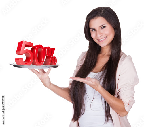 Photo: Woman presenting 50% discount on silver platter Woman presenting 50% discount on silver platter
