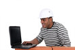 Young mason with computer