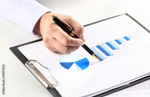 Photo: The hand draws the diagram The hand draws the diagram