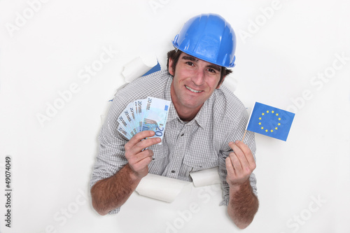 Photo: European builder with cash European builder with cash