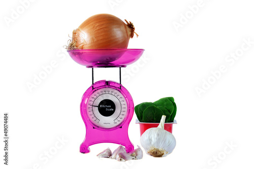 Photo: Magenta kitchen scales and vegetables Magenta kitchen scales and vegetables