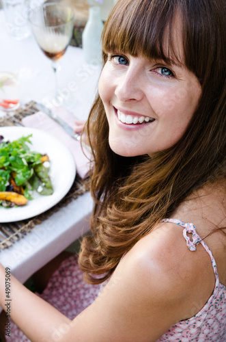 Photo: Beautiful woman with healthy green salad Beautiful woman with healthy green salad