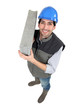 Man carrying breeze block
