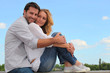 couple sitting on a wall