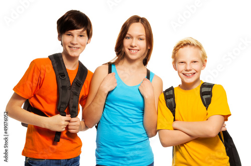 Photo: Three kids with school backpacks Three kids with school backpacks