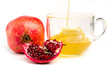 pomegranate and honey in a cup of  glass on white