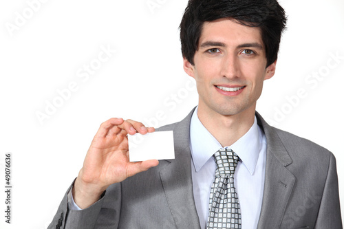 Photo: Executive with a blank business card Executive with a blank business card