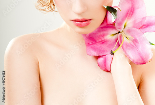 Photo: beautiful girl with pink lilies beautiful girl with pink lilies