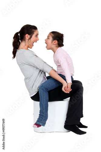 Photo: Mother and daughter shouting at each other Mother and daughter shouting at each other