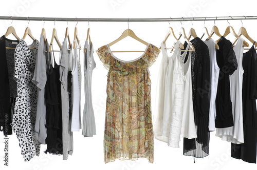 Photo: fashion clothing on hangers at the show fashion clothing on hangers at the show