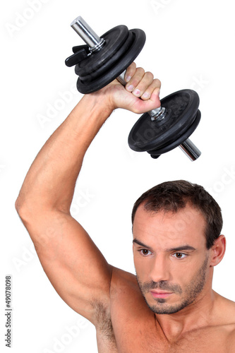 Photo: Man lifting weights Man lifting weights