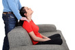 Man massaging woman on a sofa