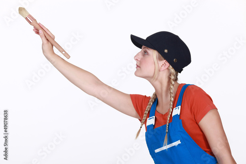 Photo: Handywoman painting on white background Handywoman painting on white background