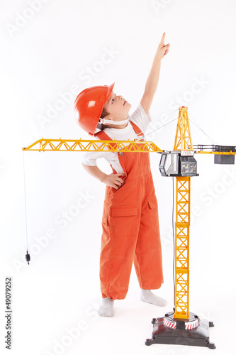 Photo: Small builder and crane on white background Small builder and crane on white background
