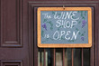 Open sign on wine shop door in St Augustine, Florida