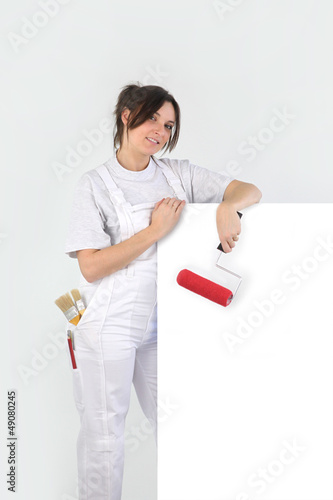 Photo: Painter holding a blank sign Painter holding a blank sign
