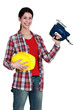 Woman with an electric jigsaw